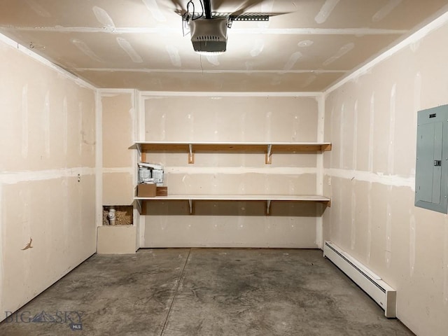 garage featuring a garage door opener, electric panel, and a baseboard heating unit