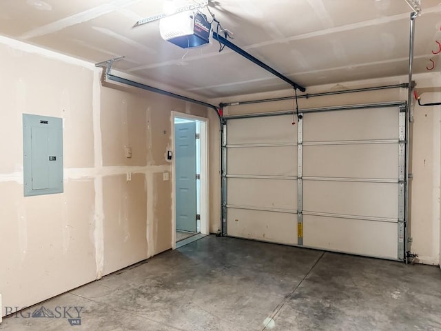 garage featuring a garage door opener and electric panel