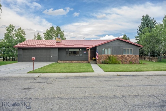 single story home with a garage and a front lawn