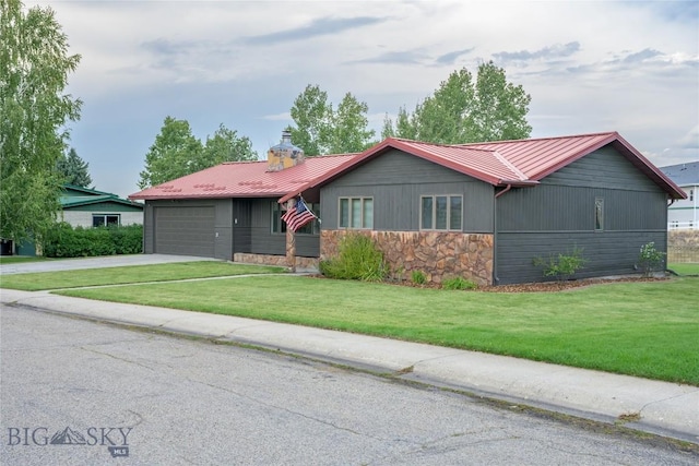 ranch-style home with a garage and a front lawn