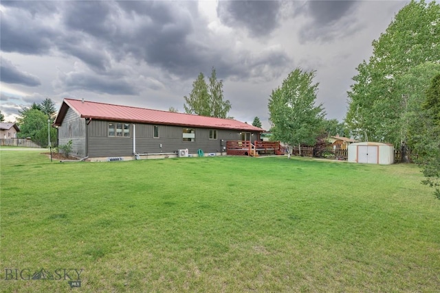 exterior space featuring a shed and a wooden deck