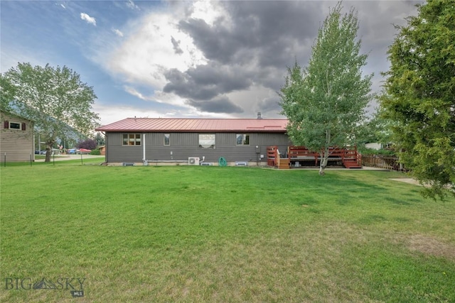 back of house featuring a yard