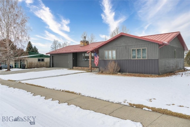 ranch-style home featuring a garage