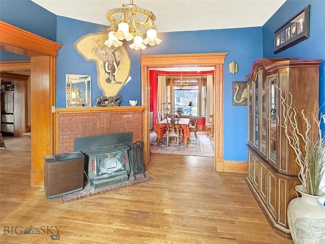 interior space featuring hardwood / wood-style floors and an inviting chandelier