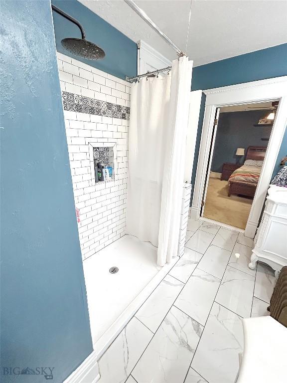 bathroom with a shower with curtain