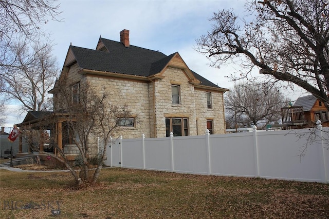 view of property exterior with a lawn