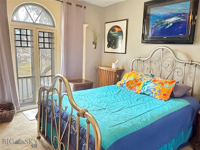 bedroom featuring light colored carpet