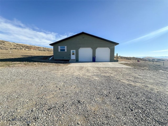 exterior space featuring an outdoor structure and a garage