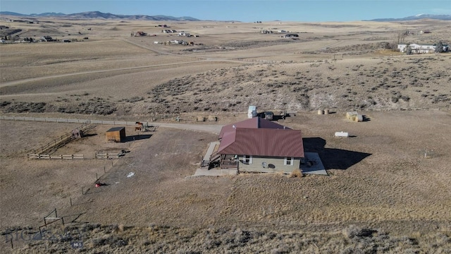 birds eye view of property with a mountain view and a rural view