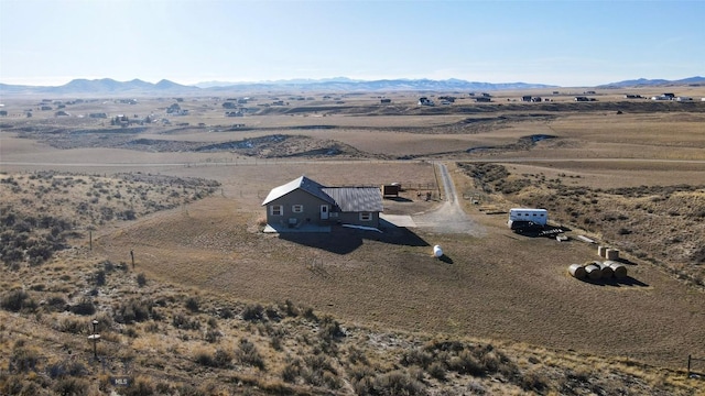 bird's eye view with a mountain view and a rural view