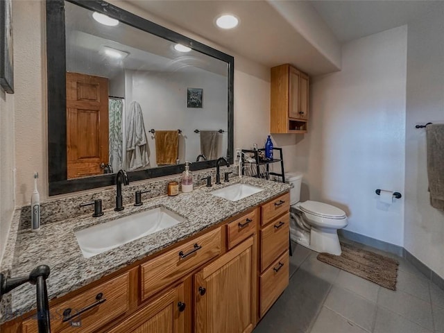 bathroom featuring tile patterned floors, vanity, curtained shower, and toilet