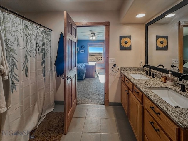 bathroom featuring ceiling fan, tile patterned flooring, and vanity