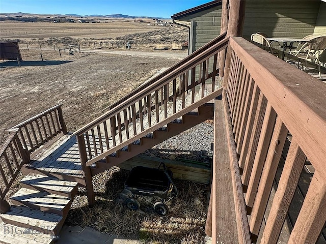 wooden deck with a mountain view