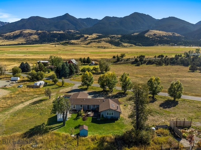 drone / aerial view featuring a mountain view and a rural view