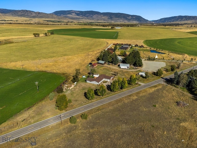 drone / aerial view featuring a mountain view and a rural view