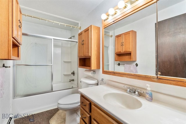 full bath featuring baseboard heating, vanity, toilet, and bath / shower combo with glass door