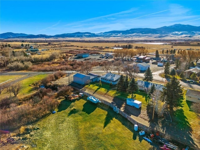 birds eye view of property featuring a mountain view