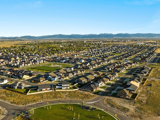 birds eye view of property featuring a mountain view