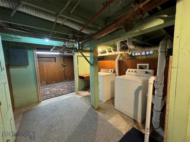 basement featuring washer and dryer and electric panel