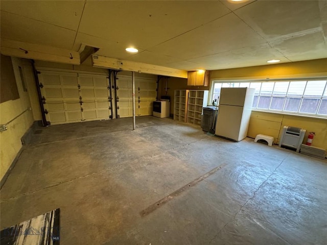 garage with white fridge