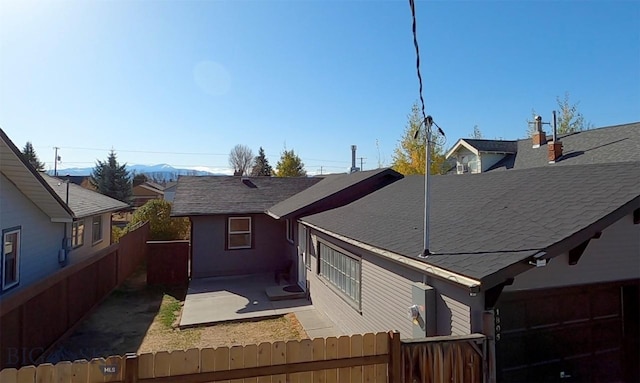 back of house with a patio