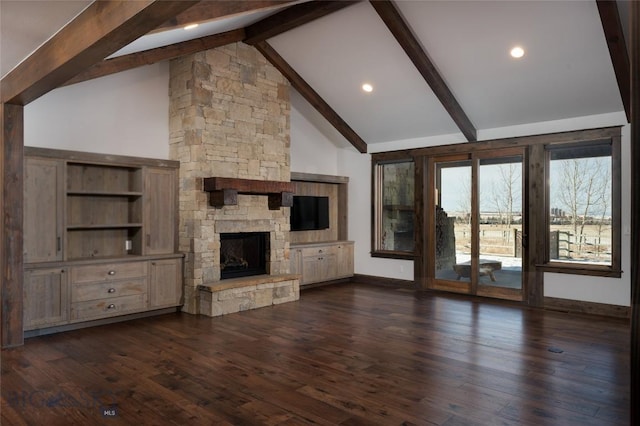 unfurnished living room featuring beam ceiling, a stone fireplace, high vaulted ceiling, and dark hardwood / wood-style floors