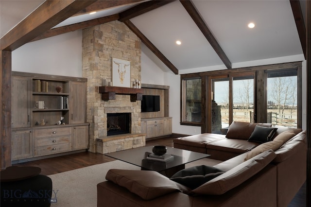 living room featuring beam ceiling, a stone fireplace, high vaulted ceiling, and dark hardwood / wood-style floors