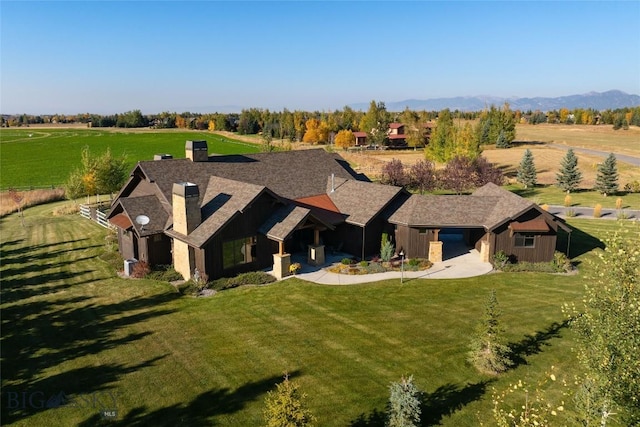 bird's eye view featuring a mountain view and a rural view