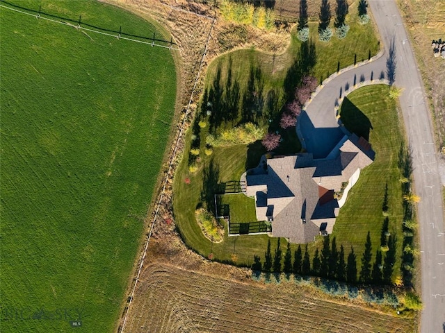 birds eye view of property with a rural view