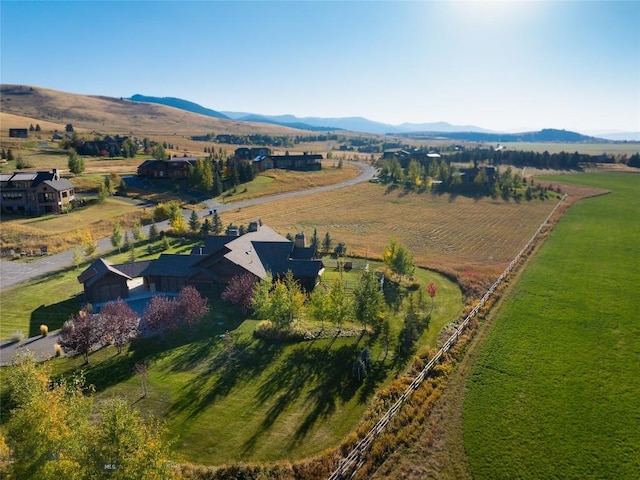 drone / aerial view featuring a mountain view and a rural view