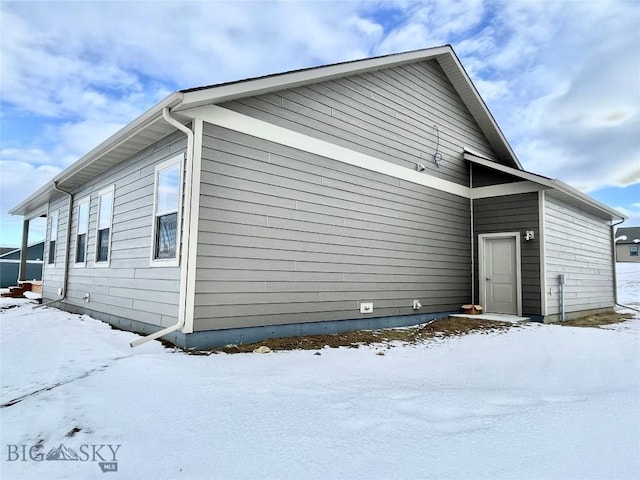 view of snow covered property