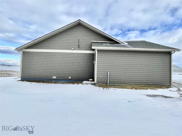 view of snow covered property