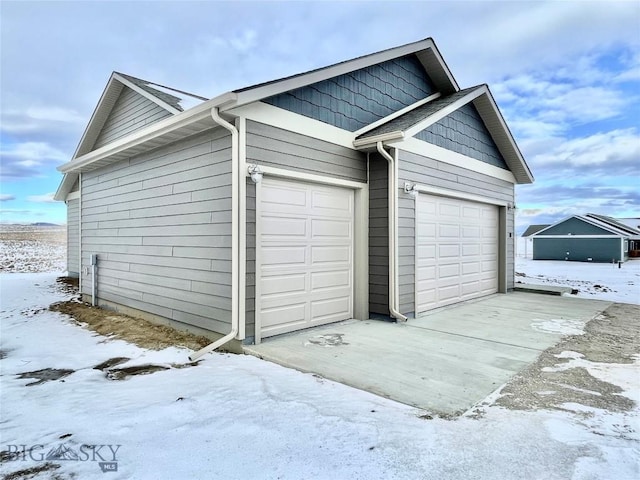 view of snow covered garage