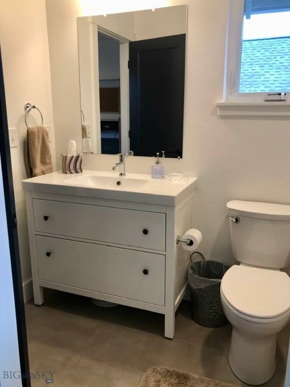 bathroom featuring vanity and toilet