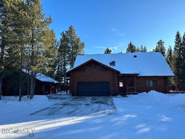 log cabin featuring a garage