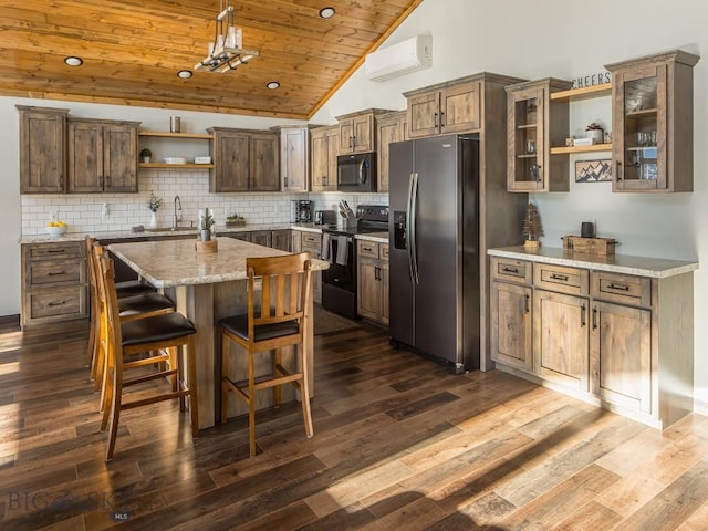 kitchen with a center island, dark wood-type flooring, sink, appliances with stainless steel finishes, and wood ceiling