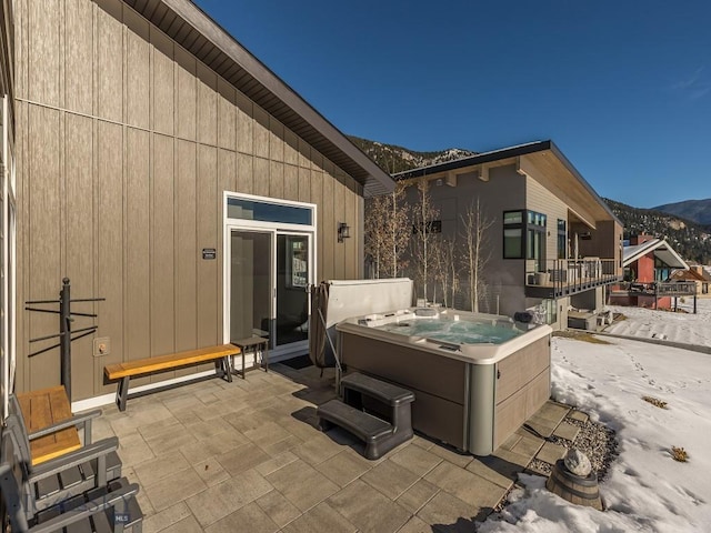 1880 Little Coyote, Big Sky, MT 59716 - view of patio with a hot tub and a mountain view