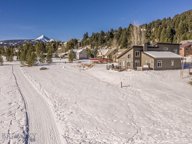 1880 Little Coyote, Big Sky, MT 59716 - snowy aerial view featuring a mountain view and a residential view