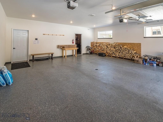 1880 Little Coyote, Big Sky, MT 59716 - garage featuring a garage door opener and recessed lighting