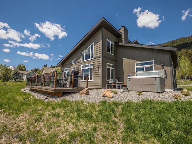 1880 Little Coyote, Big Sky, MT 59716 - back of house with a deck and a chimney