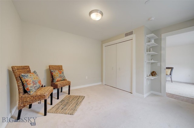 living area featuring carpet flooring