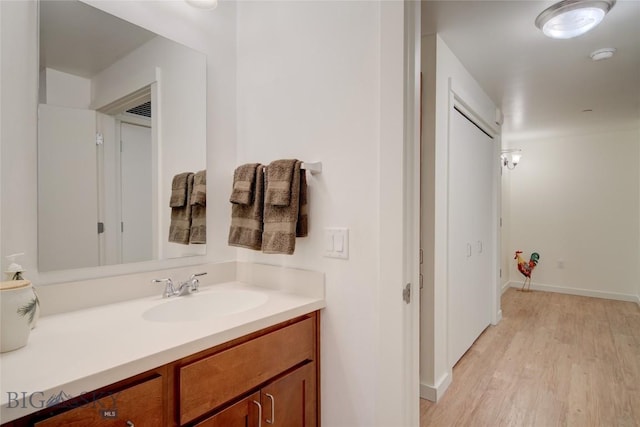 bathroom featuring vanity and hardwood / wood-style flooring