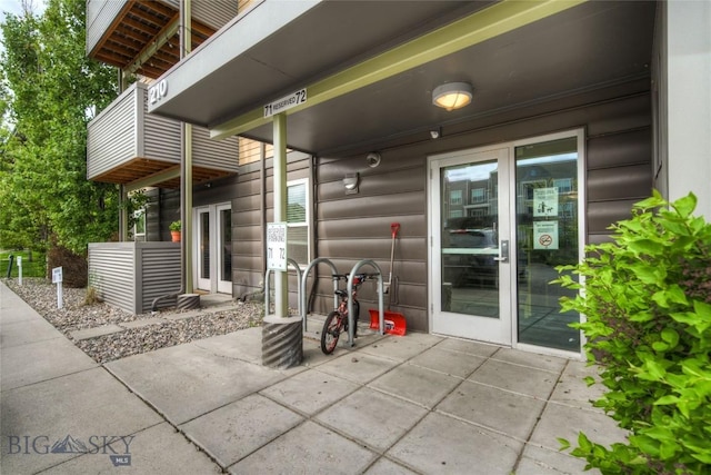 view of patio / terrace featuring a balcony and french doors