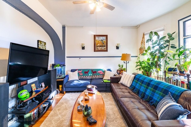 living room with ceiling fan and light wood-type flooring