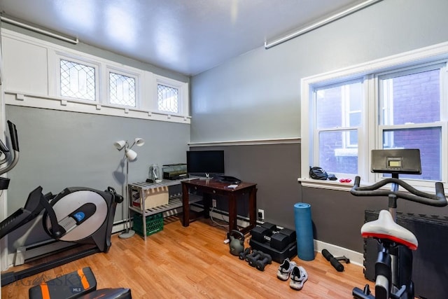 office featuring light hardwood / wood-style floors and a baseboard heating unit