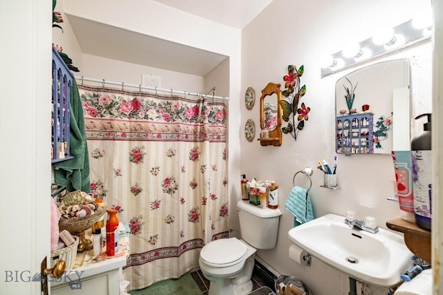 bathroom featuring sink and toilet