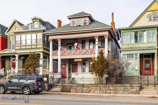 view of front of house with a balcony