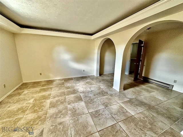 unfurnished room featuring a textured ceiling, baseboard heating, and ornamental molding