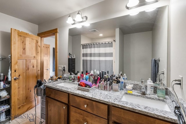 bathroom with vanity and hardwood / wood-style flooring