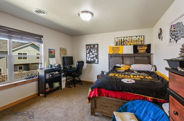 carpeted bedroom with a fireplace